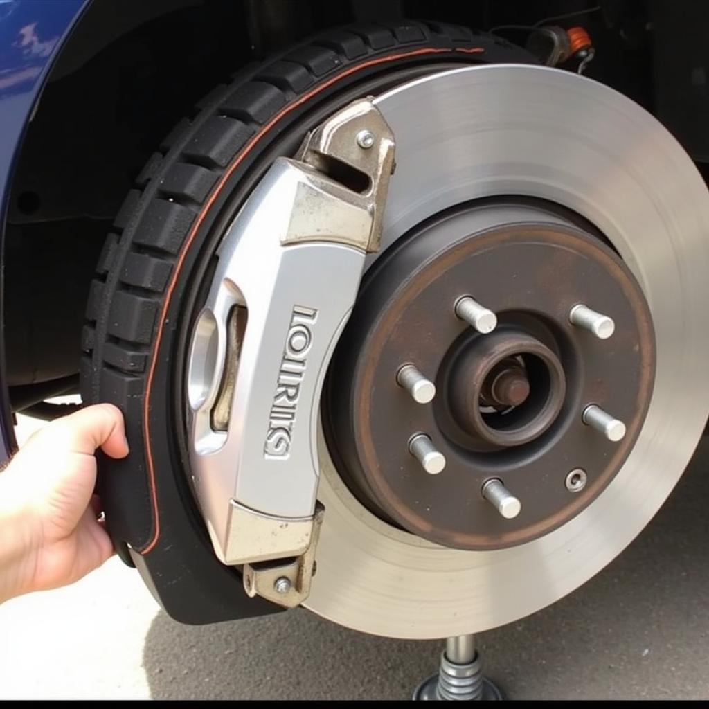 Inspecting Brake Pads on a 2004 Toyota