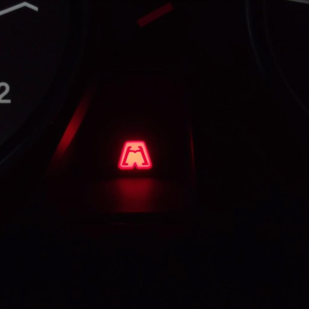 Car dashboard displaying brake warning light