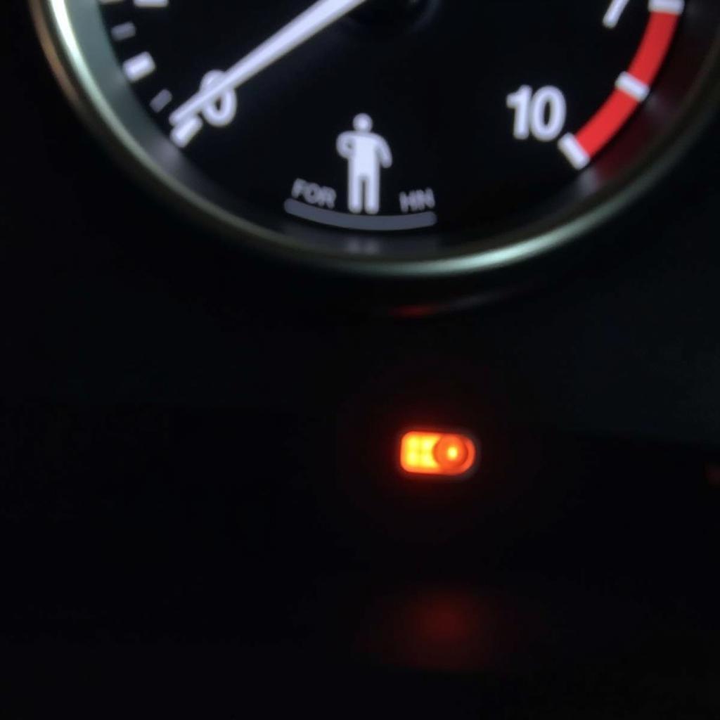 Mazda 6 dashboard displaying seat belt warning light