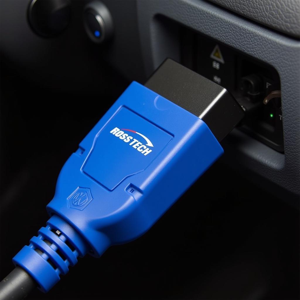 VCDS scan tool connected to a car's OBD-II port for diagnostics and programming.