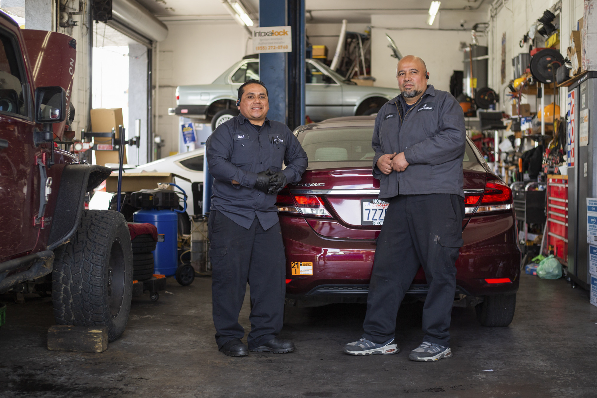 Jesus Rojas, right, and Raul Man Perez, left, co-owners of J & R Auto Repair are photographed in their shop in San Francisco, on Thursday, May 12, 2022. Photo by Nina Riggio for CalMatters