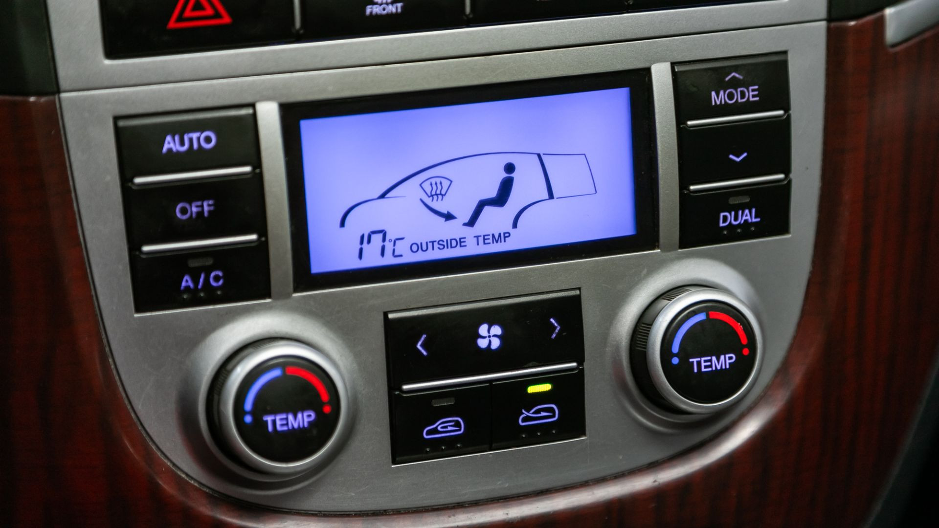 A detailed view of car HVAC controls, highlighting the interface for adjusting temperature and airflow for the vehicle's heating and cooling system.