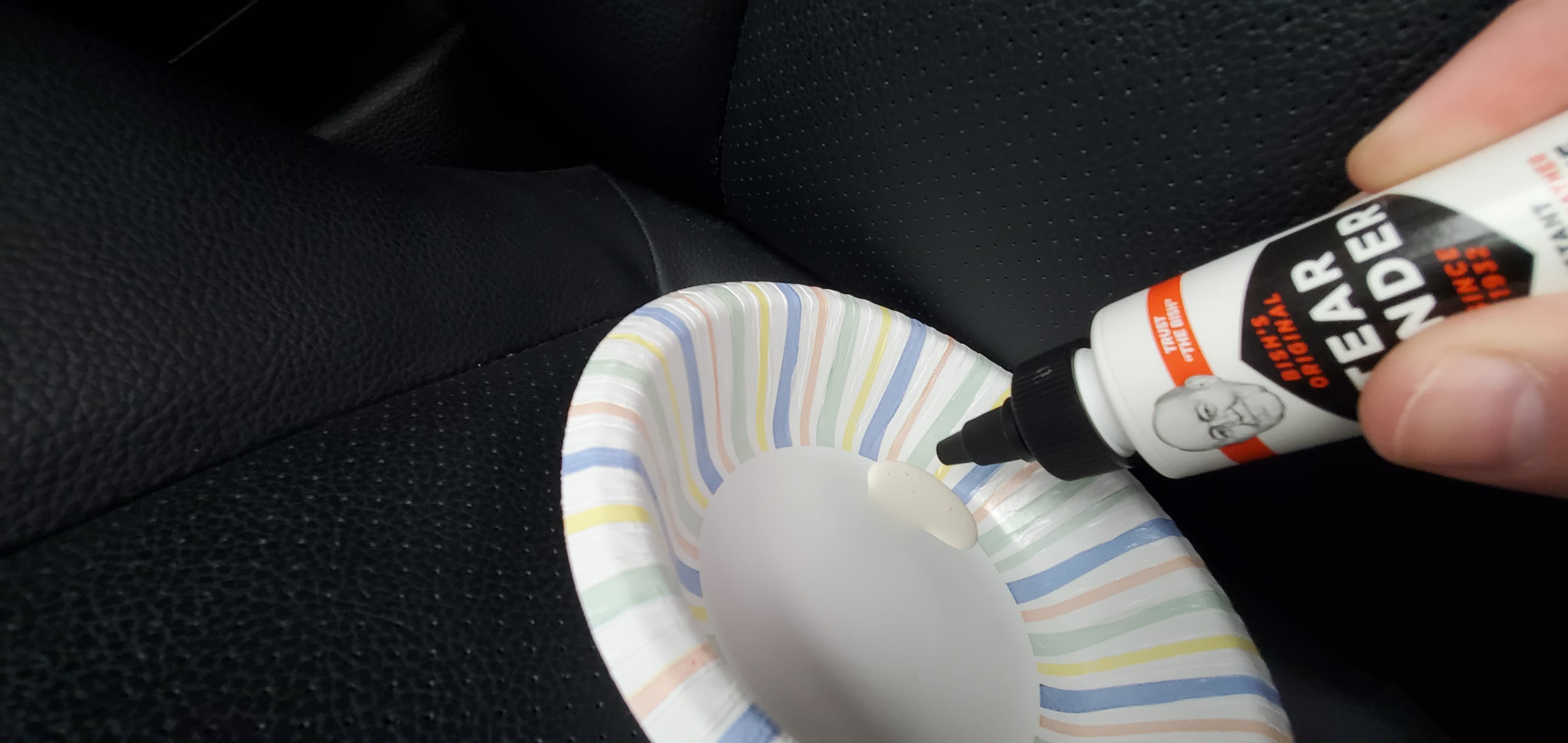 Dispensing leather adhesive into a container for car seat crack repair