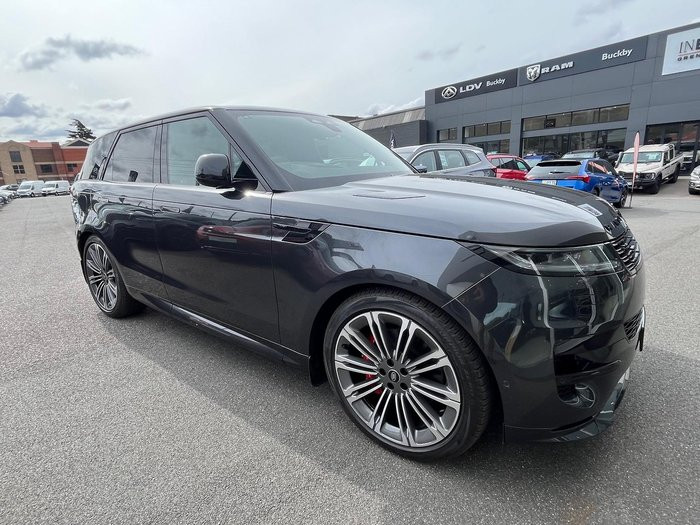 Carpathian Grey Land Rover Range Rover Sport L461 showcasing its rear profile and powered gesture tailgate capability