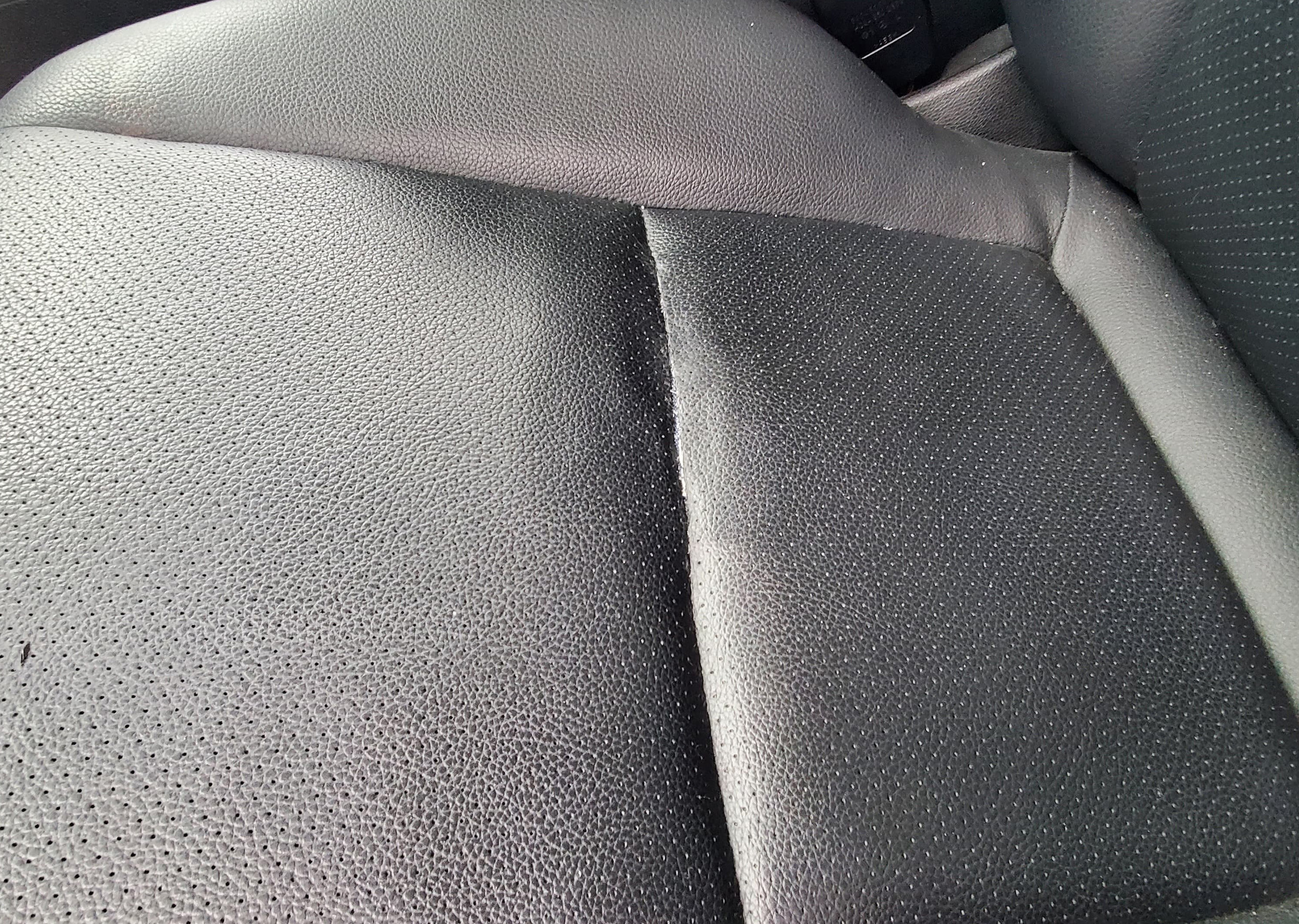 Repaired torn leather car seat seam after using leather adhesive