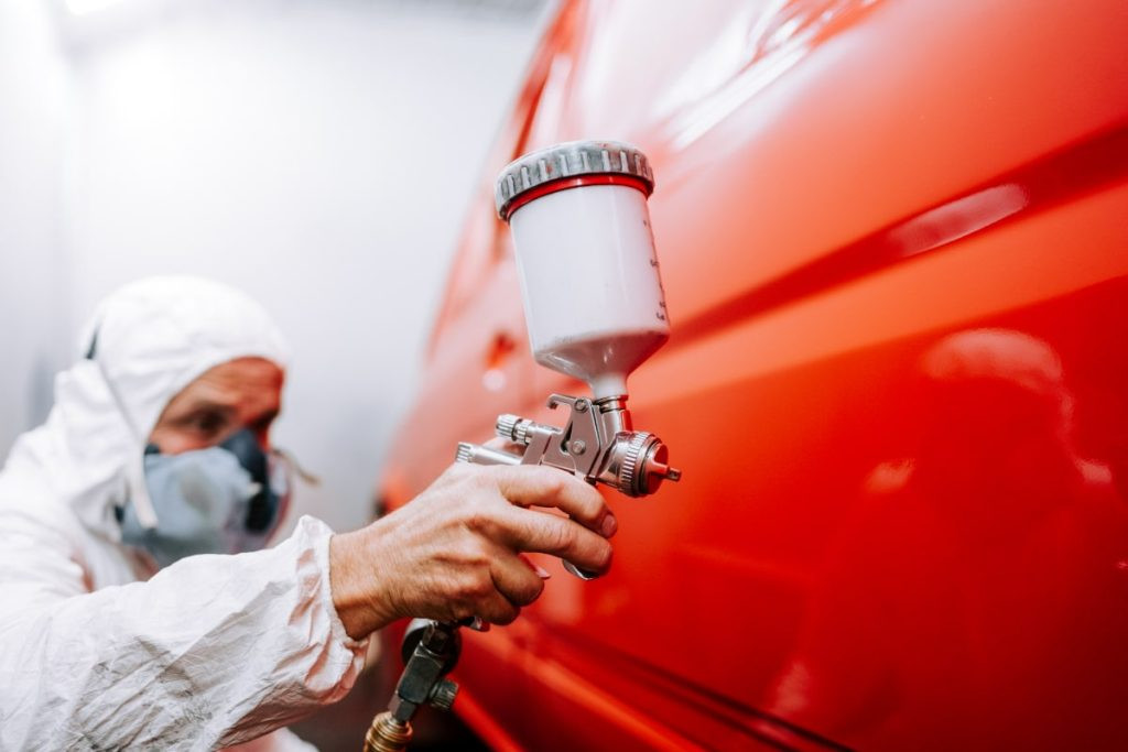 Professional car paint repair restores vehicle appearance and protects from damage