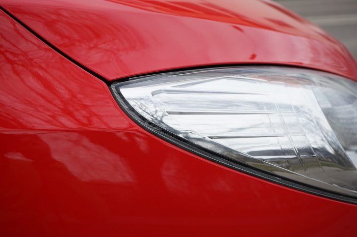 Car paint chip damage on a vehicle hood