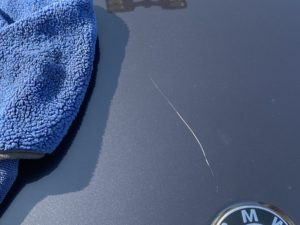 Minor car scratch on car surface, clear coat only