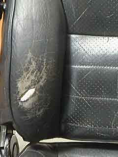 Filling a hole in a leather car seat with heavy filler in thin layers