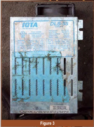 Using a battery maintainer for stable voltage during J2534 programming, essential for preventing errors when using a budget programmer.