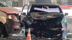 Car with severe side impact damage, including a crushed door, damaged side panel, and potential frame damage