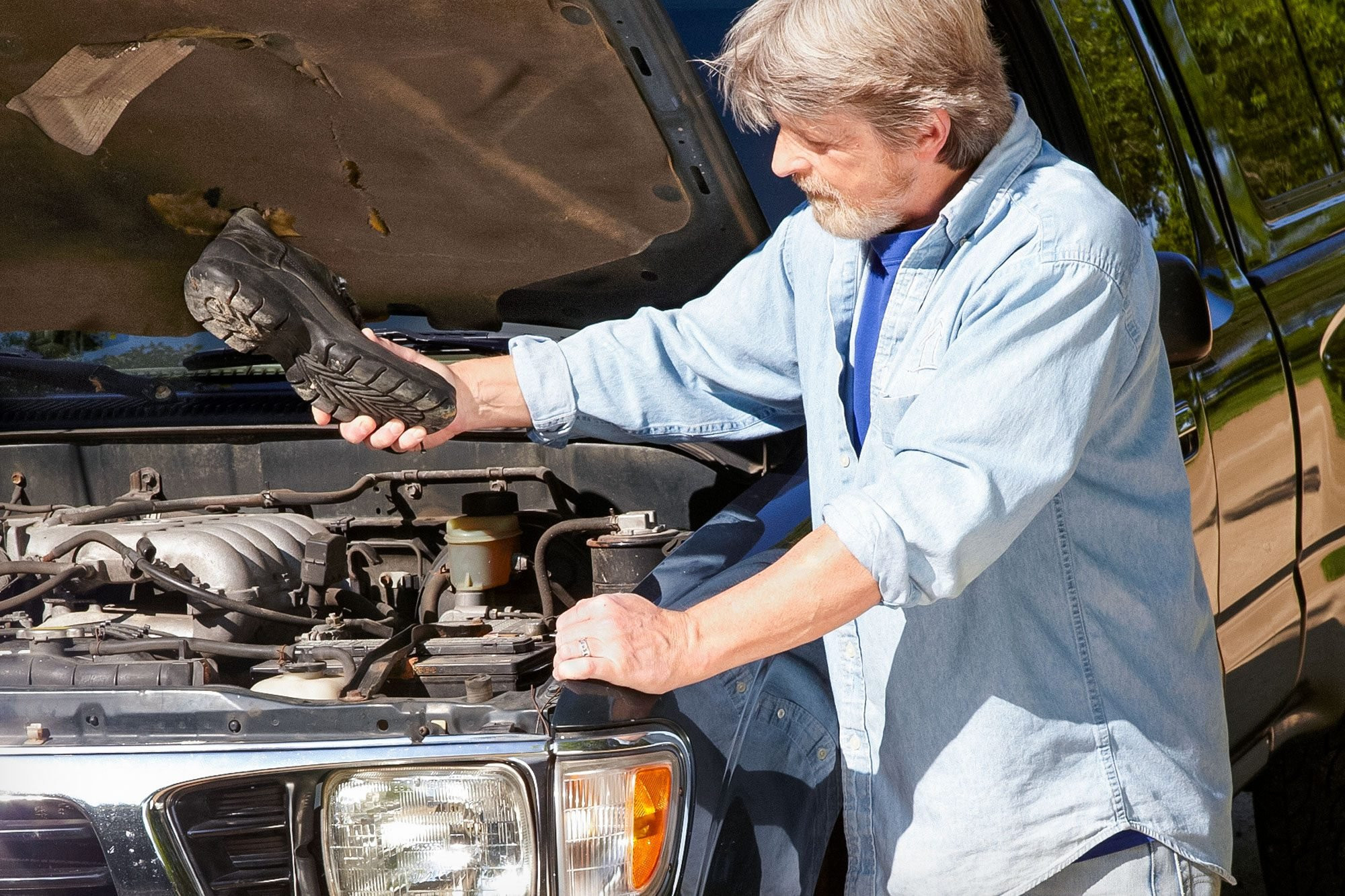 tapping car battery with a shoe