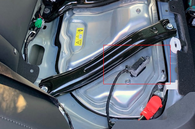 Tesla 400V Battery Disconnect showing the location of the high voltage disconnect under the rear seat