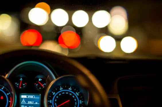 A close-up of a car’s gas gauge showing a nearly empty fuel level, indicating a potential problem with the gas hand or fuel gauge system.